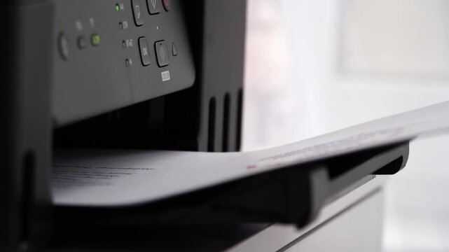 Paper sheet emerges from printer tray with precision. Controls glow softly, indicating active operation. Document prints with crisp clarity, ready for use