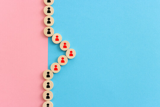 Wooden cubes with people icons over blue background, human resources and management concept
