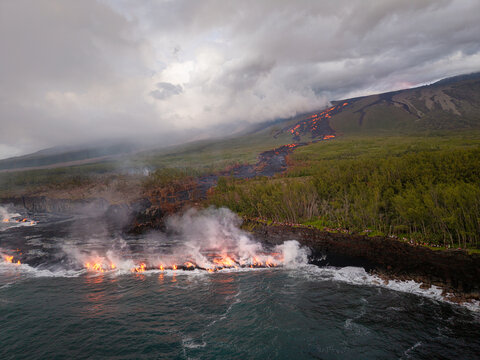 Aerial view of lava flowing into the sea, Saint Philippe, Reunion