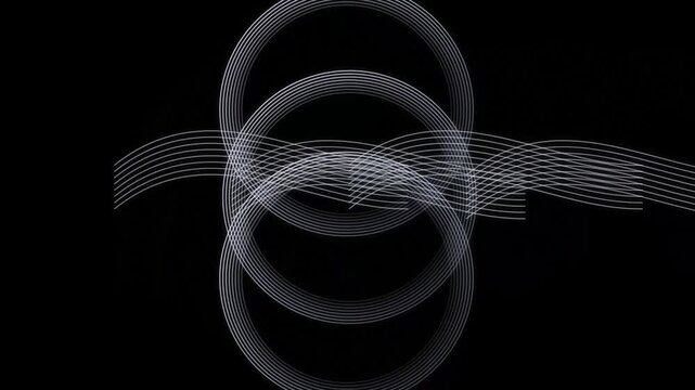 Abstract white lines forming intricate patterns on dark backdrop creating visual interest