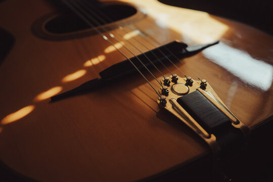 Tailpiece and bridge of an acoustic gypsy jazz guitar