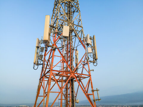 Aerial View of Telecommunication Tower with Radio Masts and Equipment in the Morning in Purwokerto, Central Java, Indonesia.