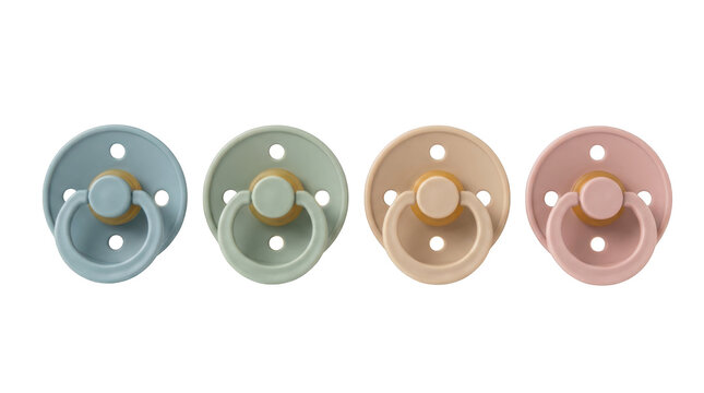 Set of four colorful baby pacifiers with rings isolated on transparent background