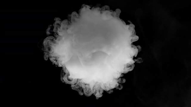An isolated puff of smoke expands and disperses against a black background, filmed at 1,000 frames per second. The detailed slow-motion movement makes it suitable as a smoke overlay for video composit