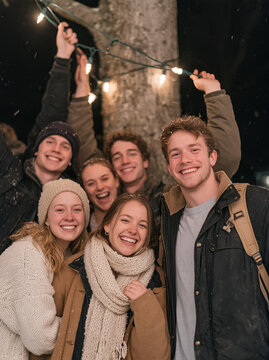 Group of Diverse Young Friends Having Fun at Christmas Street Market