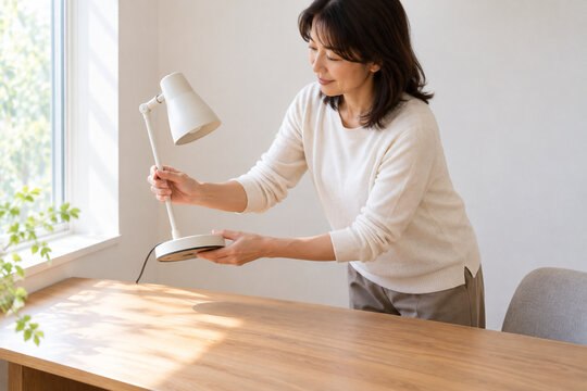 removes a bright lamp from her work area and uses softened window