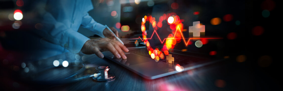 Abstract Healthcare, Medical concept, Doctor analyzing and diagnosis of heart shape symbolic with colorful digital interface showing heartbeat line illustrating health and wellness diagnosis.