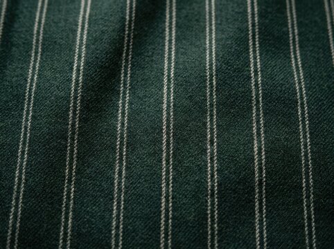 Dark green fabric background with vertical white pinstripes