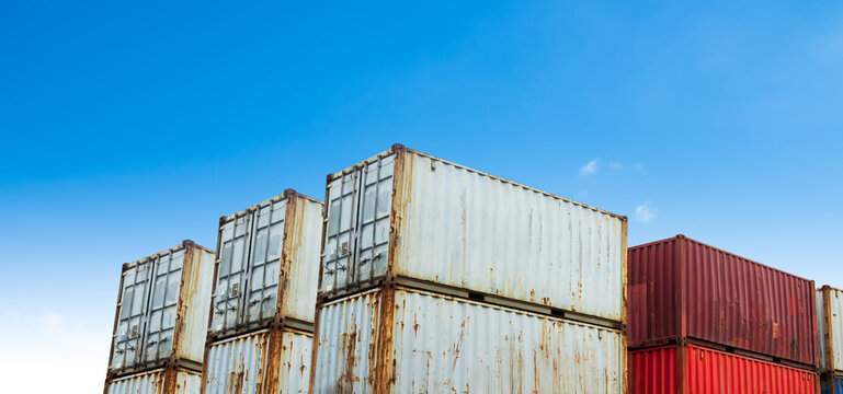 Cargo ship container goods export import international transport on blue sky background, warehouse industry business logistics transportation harbor port industrial shipping terminal cargo ship.