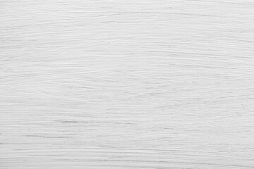 White-painted wooden board with visible wood grain and texture