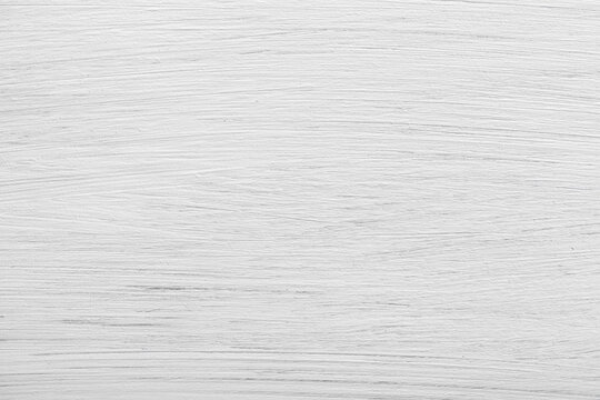White-painted wooden board with visible wood grain and texture