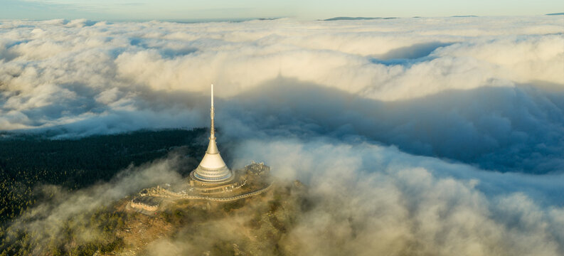 Aerial View of Jested Tower Above Rolling Clouds
