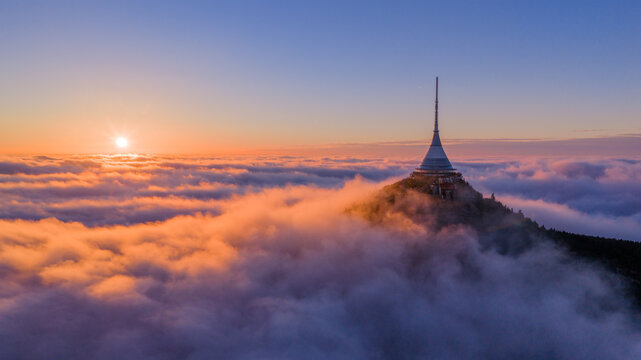 Aerial View of Jested Tower Above Rolling Clouds