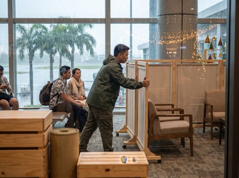 Tropical Airport Terminal Staff Preparing for Rainy Season Holiday Operations