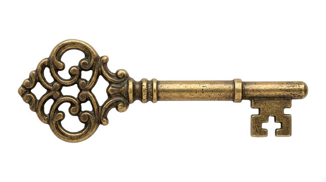 Ornate vintage brass key with intricate filigree design on plain background