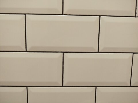 Brick and white tiled wall textures with repeating patterns and realistic surfaces, suitable for architectural backgrounds, interior design and construction projects.