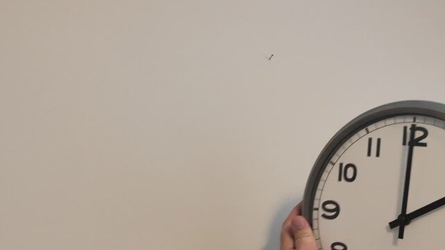 Setting back a large quartz wall clock for winter time transition