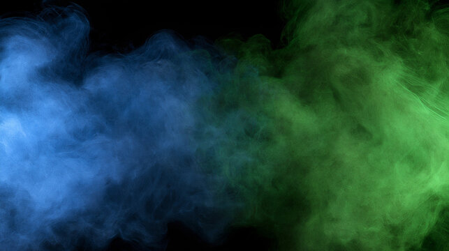 Vibrant blue and green smoke plumes swirl against a deep black background. Use this abstract texture for energetic design backdrops or creative digital compositions.