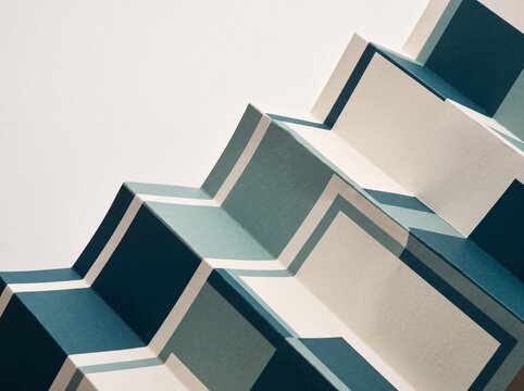 Modern teal and cream paper art accordion sculpture