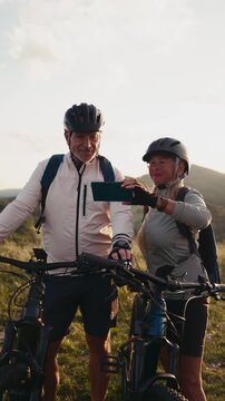 Active senior couple exploring nature on electric bicycles