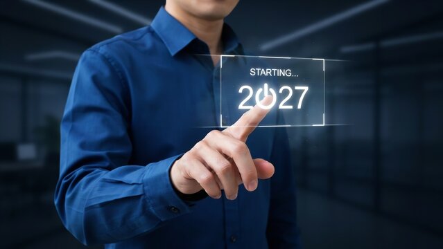 Businessman pressing futuristic interface button starting year twenty twenty seven digital holographic display in modern office environment