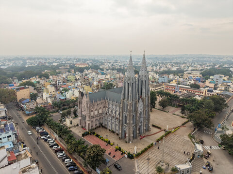A scenic aerial view of the famous St. Philomena's Cathedral in Mysore cityscape, architecture, ancient, Neo-Gothic church, twin spires in India.