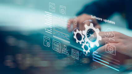 Close up hands of programmer typing laptop for software updates process with gear icon, binary code...