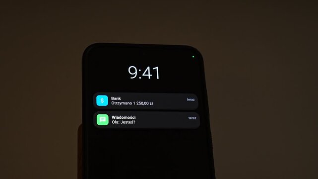 At 9:41, three Polish notifications appear on a smartphone lock screen: a calendar reminder of a meeting in 10 minutes, a bank alert for 1,250 zloty received and a message from Ola asking Jestes. A b