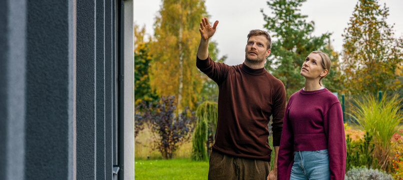 Couple viewing new house to buy. Property inspection, real estate market. Banner with copy space