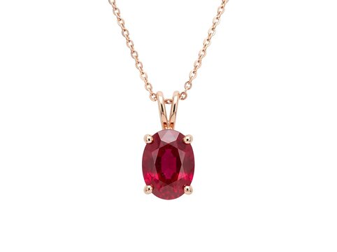 Oval cut red ruby pendant in rose gold setting isolated on pure white background
