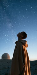 Fototapeta premium Person stargazing at night sky near an observatory dome for background and poster design focused on astronomy and contemplative solitude