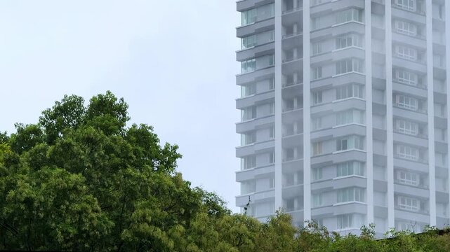 Steam Rising Beside The Prince Park Tower Tokyo on an Overcast Day