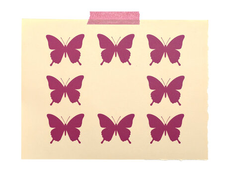 Pink butterfly silhouettes on beige paper with tape