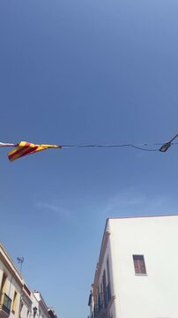 Catalan independence flag waving on a sunny day in a street