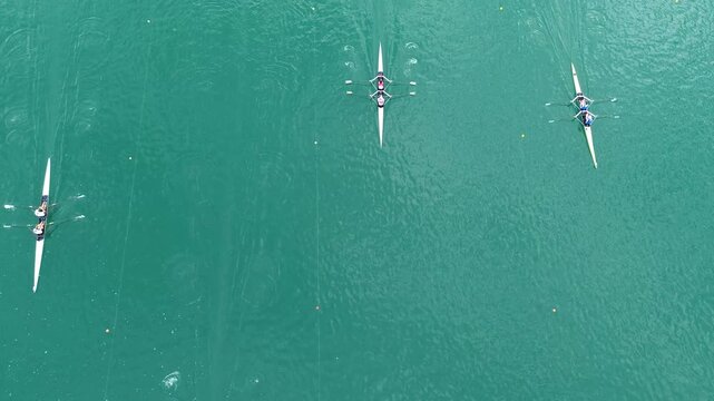Aerial drone footage of double sculls racing side by side on Lake Bled, Slovenia, during the Masters Bled rowing competition in September 2026.