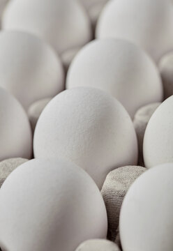 Closeup of fresh white eggs in carton
