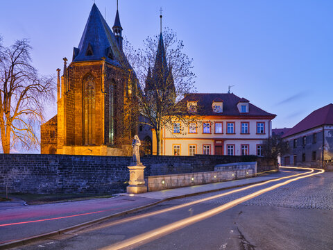 St Gothard Church floodlit at blue hour with light trails Slany
