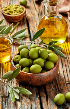 Green olives with olive oil and rustic ingredients, Mediterranean composition
