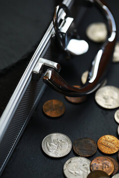 Coins and Briefcase: Symbol of Finance, Wealth, and Business
