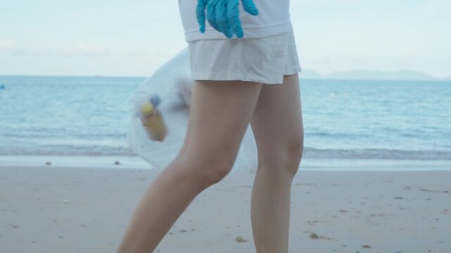 Save water. Volunteer pick up trash garbage at the beach and plastic bottles are difficult decompose prevent harm aquatic life. Earth, Environment, Greening planet, reduce global warming, Save world