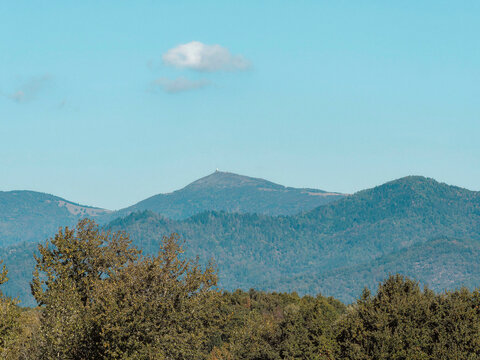 The Grand Ballon or Great Belchen, highest point of the Vosges mountains, northwest of Mulhouse, seen from Lake Michelbach in Haut-Rhin in Alsace