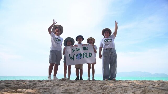 Group of teacher and school children on ecotourist trip  learning show beach take care of environment.