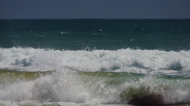 small surf breaking in the ocean