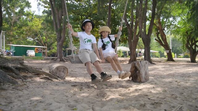Children exploring nature in a green forest looking up and observing wildlife outdoor adventure, environmental education wildlife observation childhood and nature conservation.