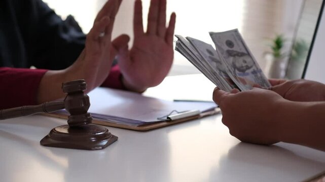 A lawyer refusing a bribe by rejecting cash offered by a client, symbolizing integrity, honesty, and ethical responsibility in the legal profession and justice system
