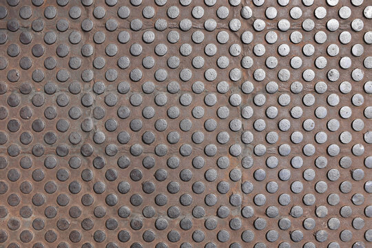 rusty embossed dot metal texture, non slip stud pattern, industrial background