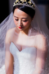 Elegant East Asian Bride Portrait with Pearl Tiara and Beaded Veil, Romantic Wedding Shot © jeson