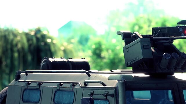 A powerful military vehicle is showcased, featuring a high tech weapon system. Sunlight filters through the trees, highlighting its robust design and tactical capabilities in a vibrant, green setting.