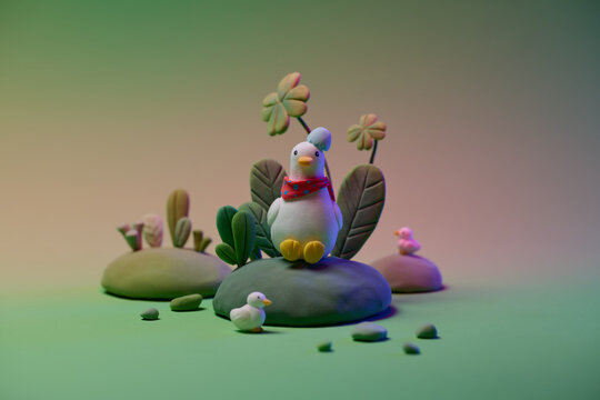 Cute Duck Figurines in Colorful Nature Scene With Leafy Background