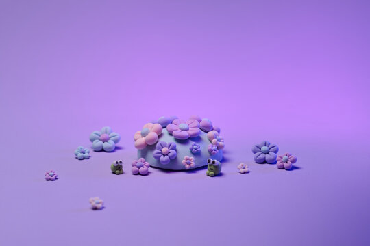 Pastel Floral Arrangement With Cute Little Models In Purple Background